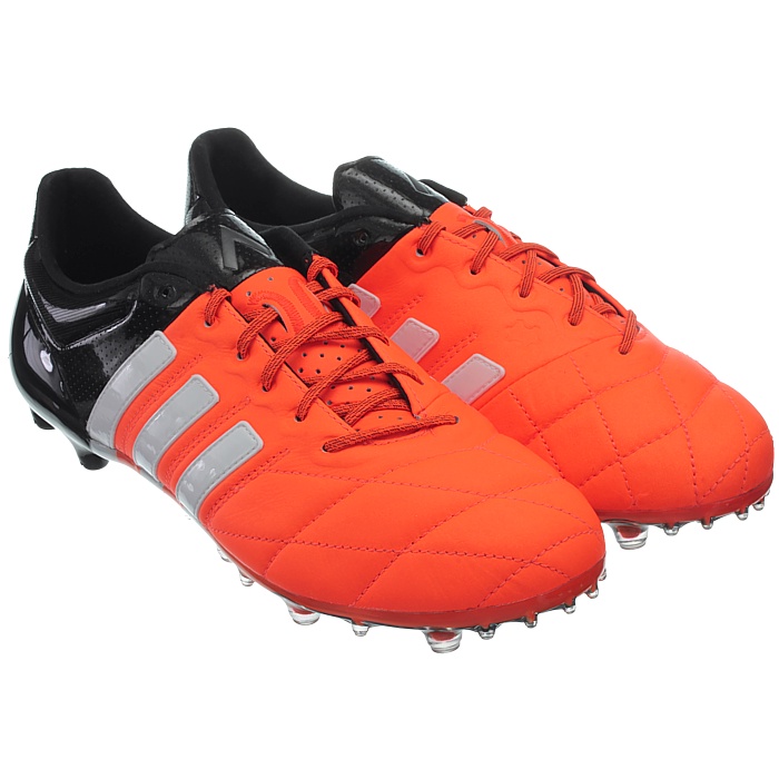 orange and black adidas boots